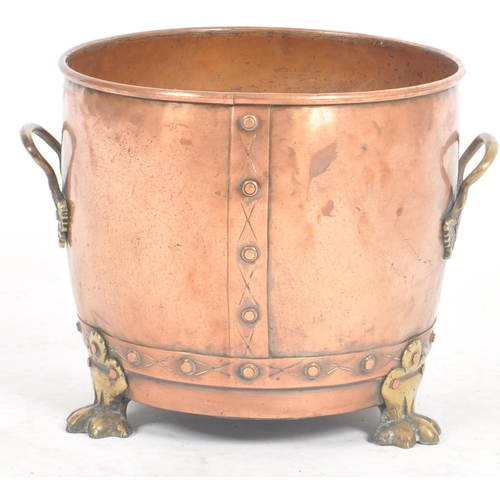 254 - A late 19th Century Victorian copper and brass planter of tapering barrel form with brass handles an... 