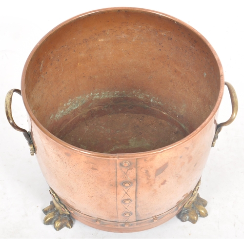 254 - A late 19th Century Victorian copper and brass planter of tapering barrel form with brass handles an... 