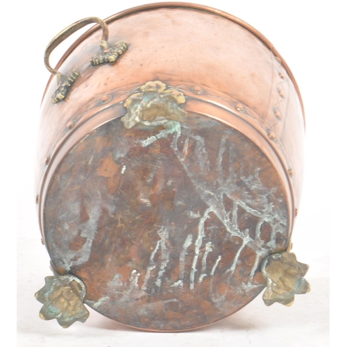 254 - A late 19th Century Victorian copper and brass planter of tapering barrel form with brass handles an... 