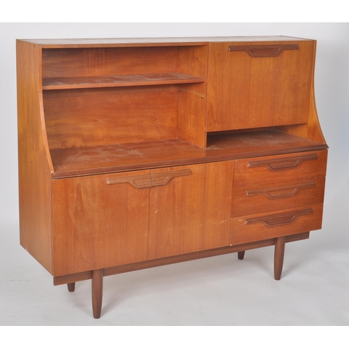 257 - Beautility - A retro vintage 1970s teak wood highboard / sideboard credenza having a shelved three q... 