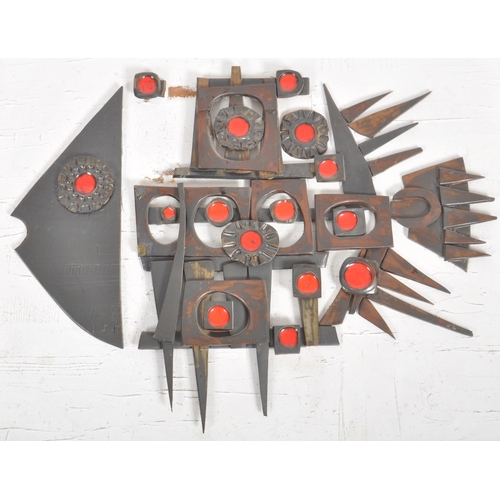 259 - A retro 20th Century 1960s brutalist stylised studio art fish wall art having applied ceramic pieces... 