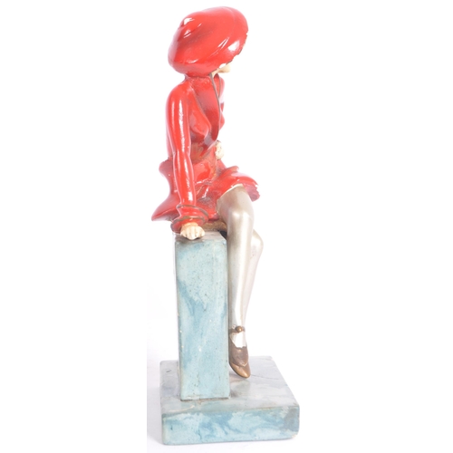 26 - A vintage 20th Century Art Deco hand painted plaster figure in the form a well dressed lady perched ... 