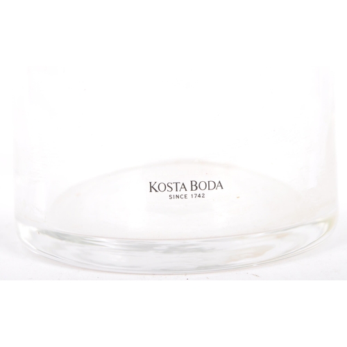 263 - Kosta Boda - A late 20th Century Swedish clear glass water jug having a central yellow and orange ab... 