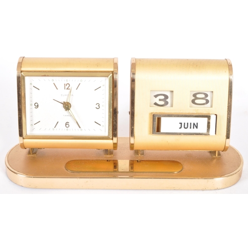 267 - Europa - A retro mid 20th Century desk clock and calendar having two separate section with brass eff... 