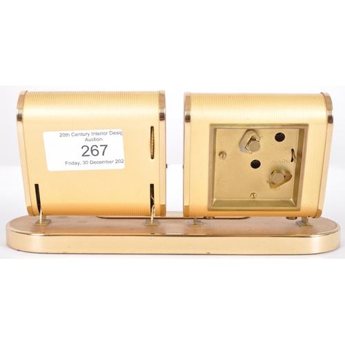 267 - Europa - A retro mid 20th Century desk clock and calendar having two separate section with brass eff... 