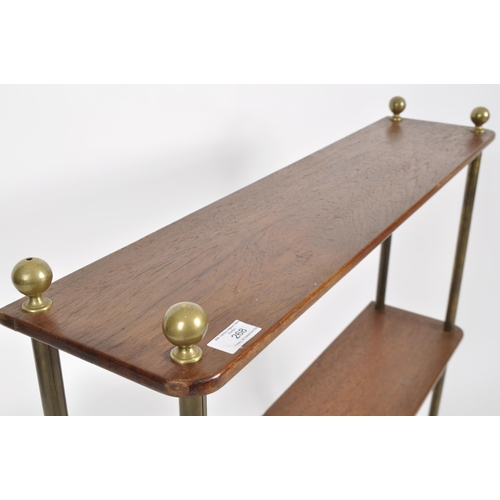 268 - A late 19th Century Victorian mahogany and brass open bookcase / display shelves. Brass ball finials... 