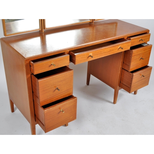 284 - Loughborough Furniture - A retro mid 20th Century 1960s teak dressing table desk having a triptych o... 