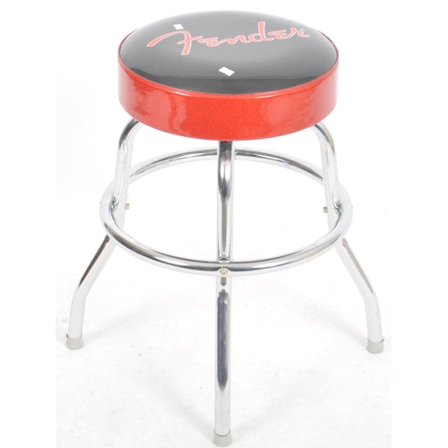 287 - Fender - A Contemporary guitar stool having a polyurethane foam pad top with 'Fender' in red cross t... 