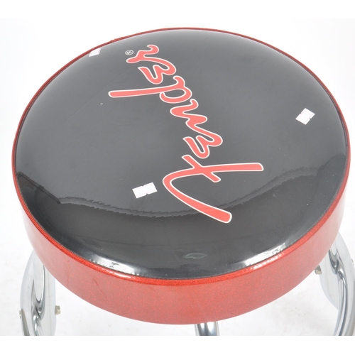 287 - Fender - A Contemporary guitar stool having a polyurethane foam pad top with 'Fender' in red cross t... 