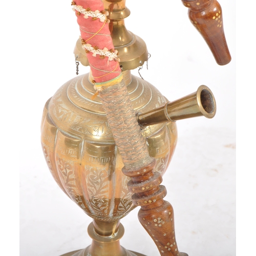 288 - A large retro vintage 20th Century Middle Eastern brass hookah pipe having geometric patterns to the... 