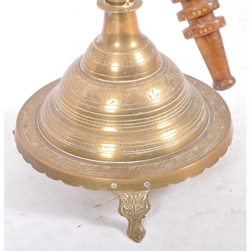 288 - A large retro vintage 20th Century Middle Eastern brass hookah pipe having geometric patterns to the... 