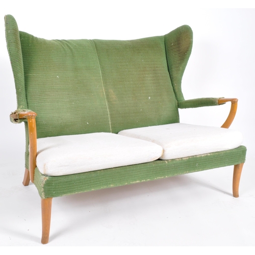 294 - Parker Knoll - Papa Bear -  A retro mid 20th Century designer wingback two seater sofa settee having... 