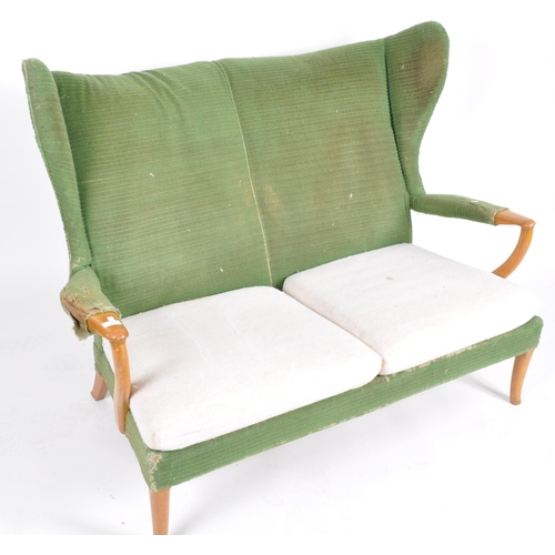 294 - Parker Knoll - Papa Bear -  A retro mid 20th Century designer wingback two seater sofa settee having... 