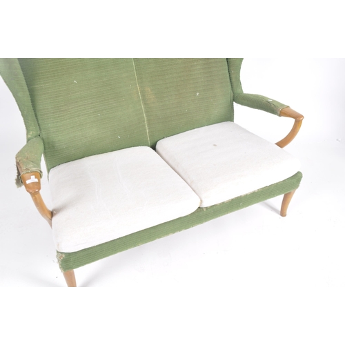 294 - Parker Knoll - Papa Bear -  A retro mid 20th Century designer wingback two seater sofa settee having... 