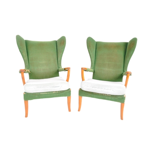 295 - Parker Knoll - Papa Bear - A matching pair of mid 20th Century designer wingback armchairs. Each cha... 