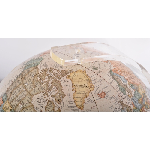 296 - George F Cram Company - A 20th Century American desk top globe raised a one piece moulded Perspex st... 