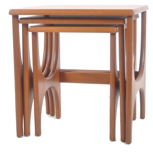 298 - Stonehill - A retro mid 20th Century 1960s teak nest of three tables. The graduating nest having cha... 