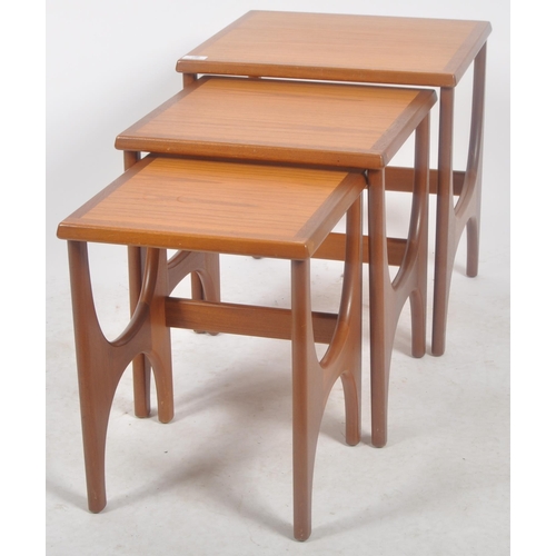 298 - Stonehill - A retro mid 20th Century 1960s teak nest of three tables. The graduating nest having cha... 