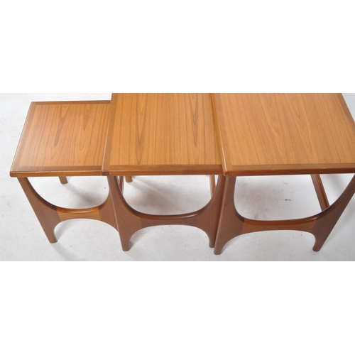 298 - Stonehill - A retro mid 20th Century 1960s teak nest of three tables. The graduating nest having cha... 