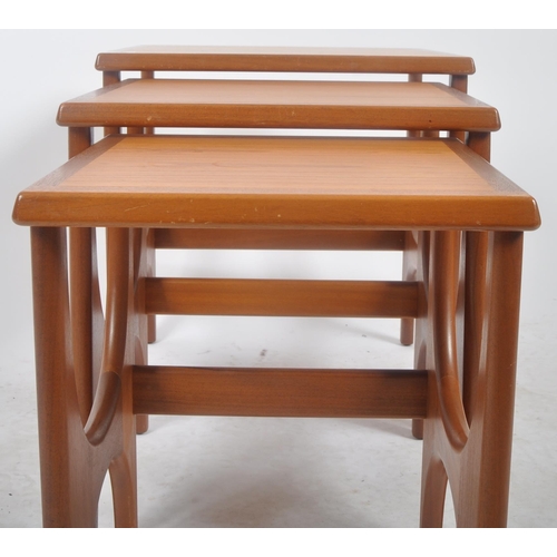 298 - Stonehill - A retro mid 20th Century 1960s teak nest of three tables. The graduating nest having cha... 