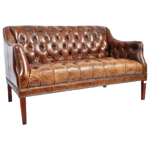 30 - A 20th Century brown leather Chesterfield button backed three seater sofa settee with brass stud det... 