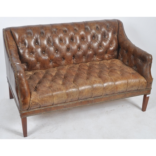 30 - A 20th Century brown leather Chesterfield button backed three seater sofa settee with brass stud det... 