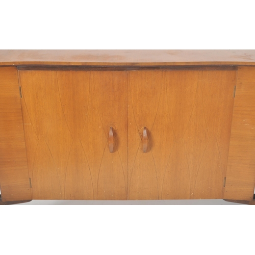 322 - Everest - Helix - A retro mid 20th Century teak and walnut sideboard credenza having a shaped top wi... 