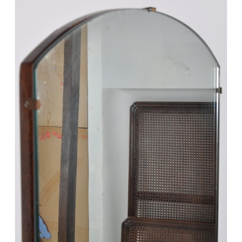 323 - A vintage 20th Century Art Deco frameless full length cheval mirror having a arched top and oak back... 