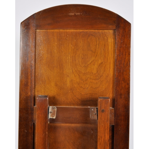 323 - A vintage 20th Century Art Deco frameless full length cheval mirror having a arched top and oak back... 