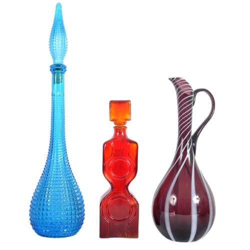 324 - A mixed selection of mid 20th Century studio art glass decanters including a Italian Empoli genie bo... 