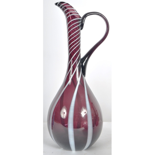 324 - A mixed selection of mid 20th Century studio art glass decanters including a Italian Empoli genie bo... 