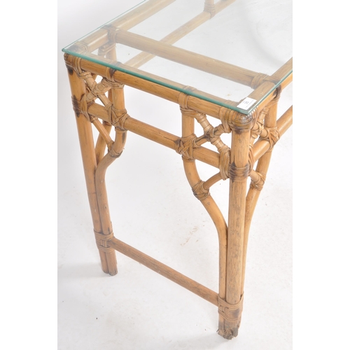 35 - A retro vintage 20th Century bamboo console / hall table of elongated form having a clear glass top ... 