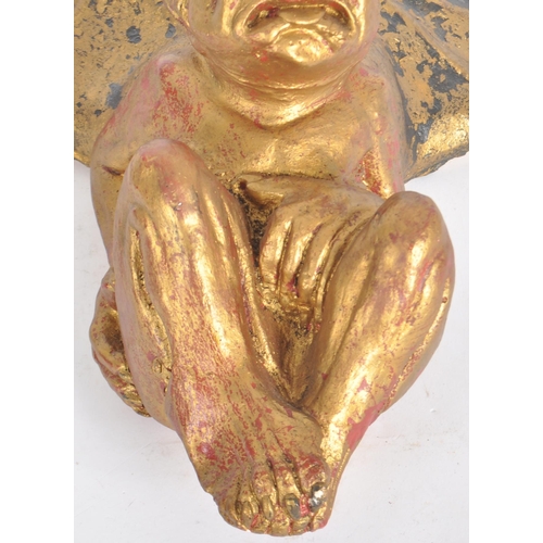 36 - A vintage 20th Century gilt plaster gargoyle wall plaque / figure having wings open moulded in a hun... 