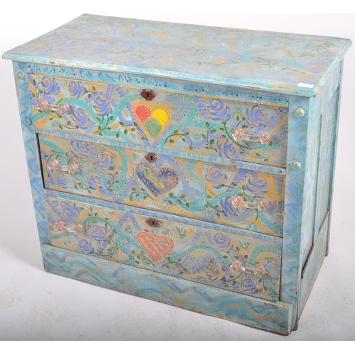 372 - A 20th Century painted pine chest of drawers having a three drawers with light blue coloured ground ... 