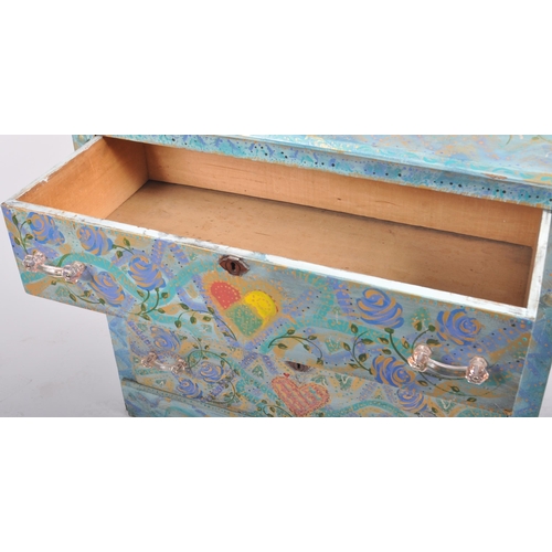 372 - A 20th Century painted pine chest of drawers having a three drawers with light blue coloured ground ... 