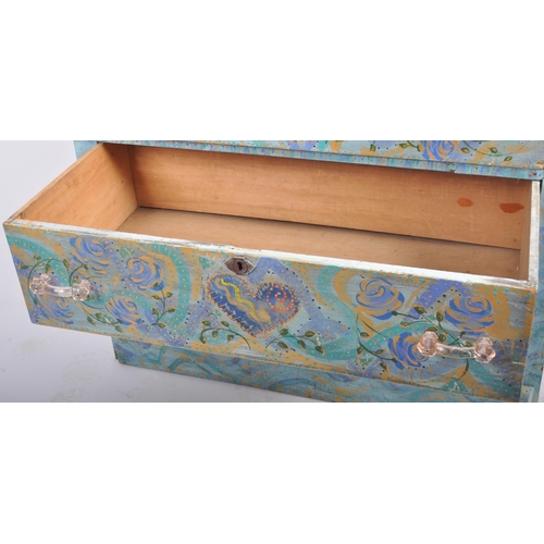 372 - A 20th Century painted pine chest of drawers having a three drawers with light blue coloured ground ... 