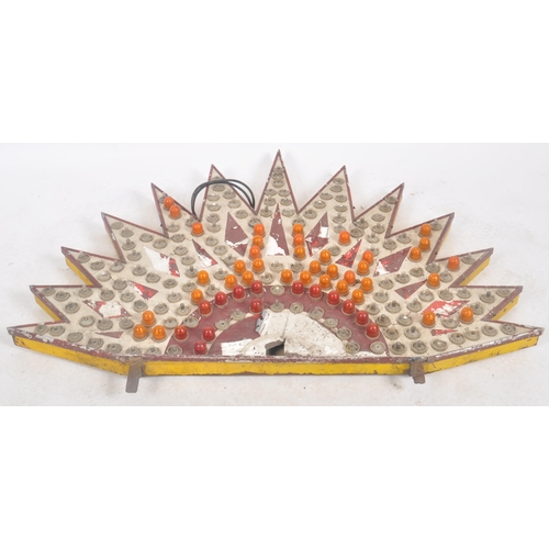 379 - A mid 20th Century fairground / funfair half starburst light panel featuring orange lights and the o... 