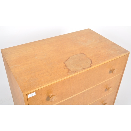 382 - G Plan - A retro mid 20th Century oak chest of drawers having a straight bank four drawers each with... 