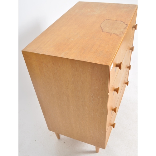 382 - G Plan - A retro mid 20th Century oak chest of drawers having a straight bank four drawers each with... 