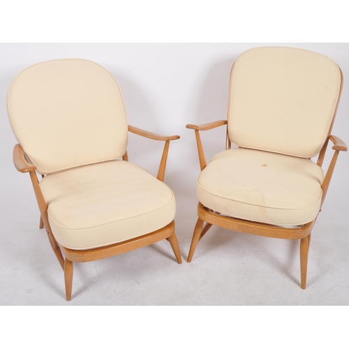 395 - Lucian Ercolani - Ercol - Model 334 - A pair of retro vintage 1960s beech and elm armchairs / easy l... 