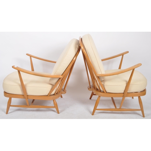 395 - Lucian Ercolani - Ercol - Model 334 - A pair of retro vintage 1960s beech and elm armchairs / easy l... 