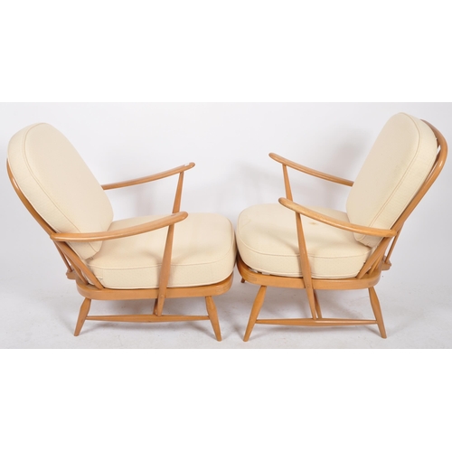 395 - Lucian Ercolani - Ercol - Model 334 - A pair of retro vintage 1960s beech and elm armchairs / easy l... 