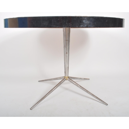 398 - A retro vintage mid 20th Century formica top kitchen dining table of circular form having a fruit an... 