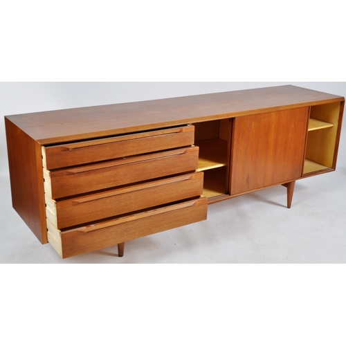 402 - A. H. Mcintosh & Co - A retro 20th Century teak sideboard credenza having a bank of four graduating ... 