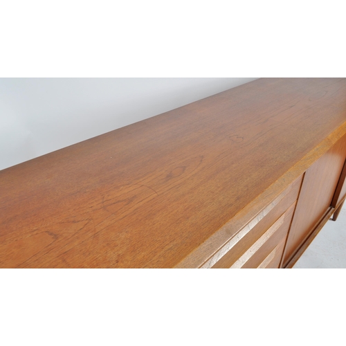 402 - A. H. Mcintosh & Co - A retro 20th Century teak sideboard credenza having a bank of four graduating ... 