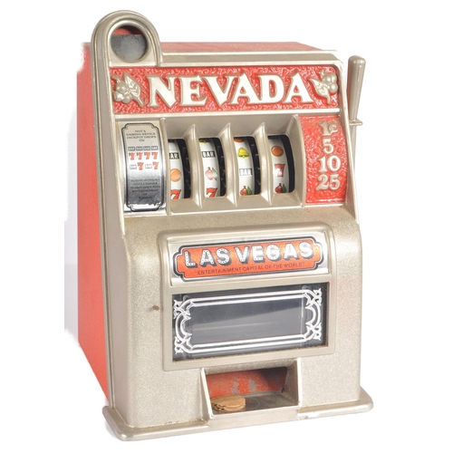 407 - Bonanza Bank - A retro 20th Century amusement arcade miniature fruit machine of typical form with 'N... 