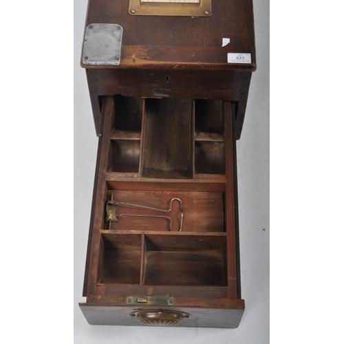 423 - Gledhills & Sons - A 19th Century Victorian oak cased cash register / till having a pull out lower s... 