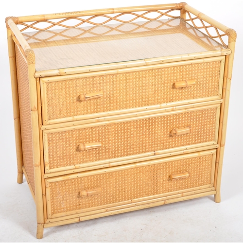 427 - A retro vintage mid 20th Century 1970s bamboo & rattan chest of drawers. The chest having a gallery ... 