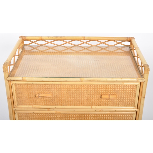 427 - A retro vintage mid 20th Century 1970s bamboo & rattan chest of drawers. The chest having a gallery ... 