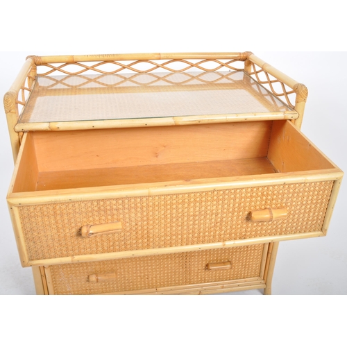 427 - A retro vintage mid 20th Century 1970s bamboo & rattan chest of drawers. The chest having a gallery ... 